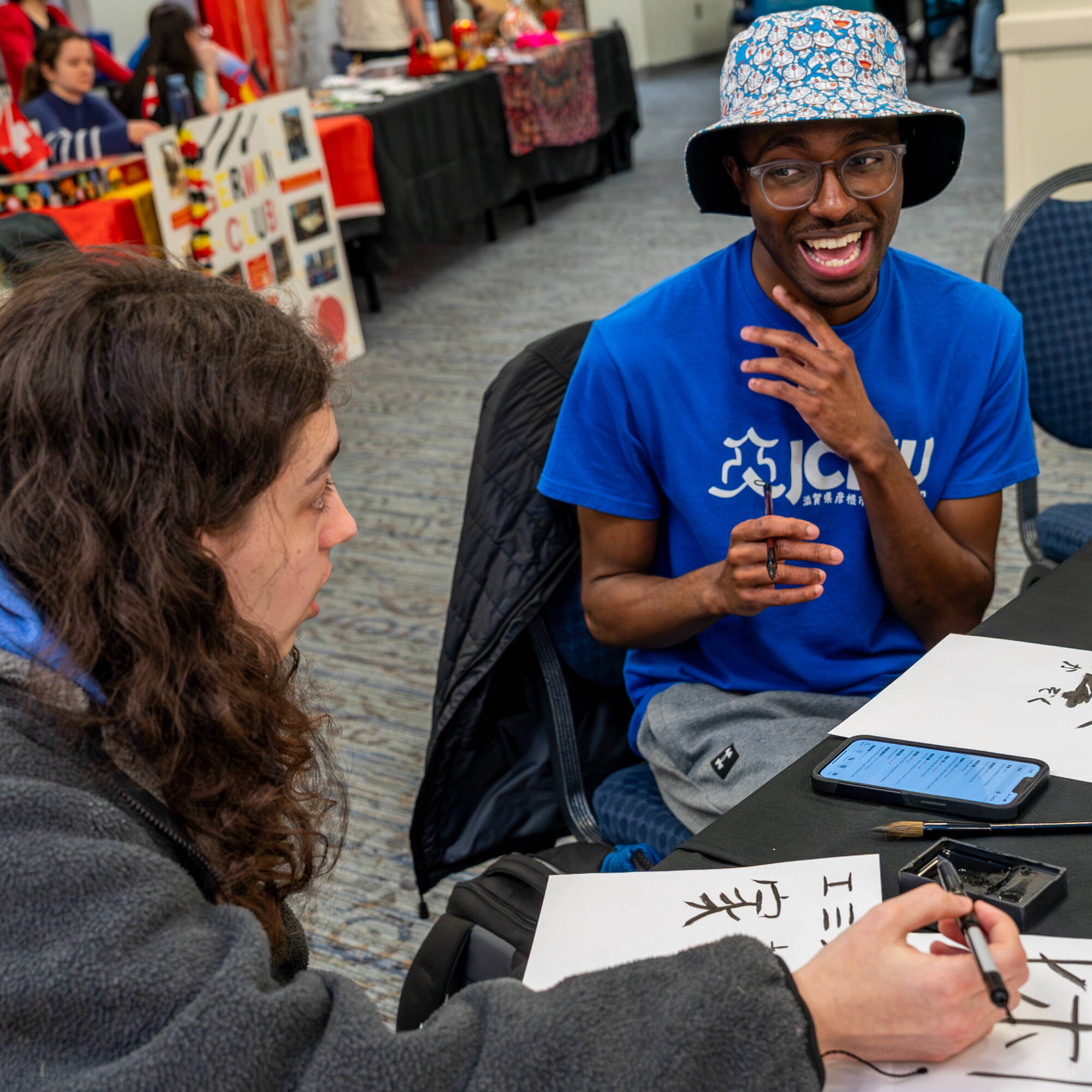 Students write in Japanese as part of the Global Language and Culture Festival at the Kirkhof Center